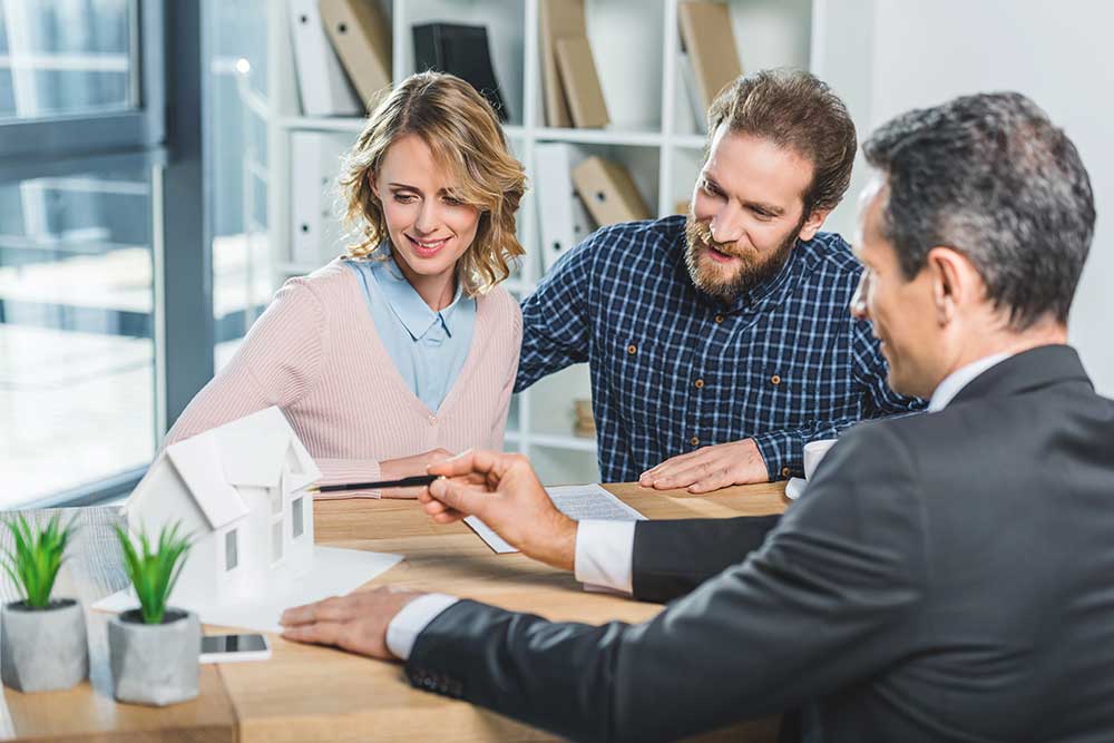 Couple at real estate agency