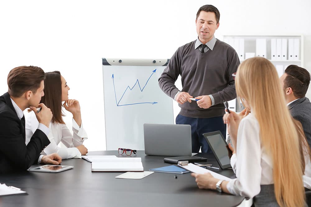 Group of people with business trainer