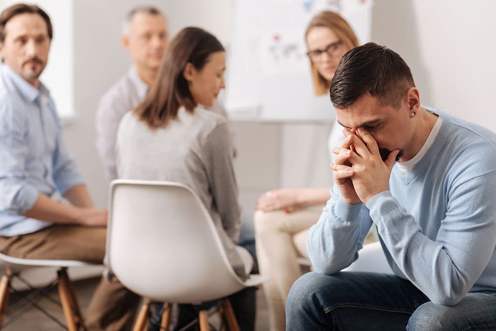 Upset male thinking about his mistakes